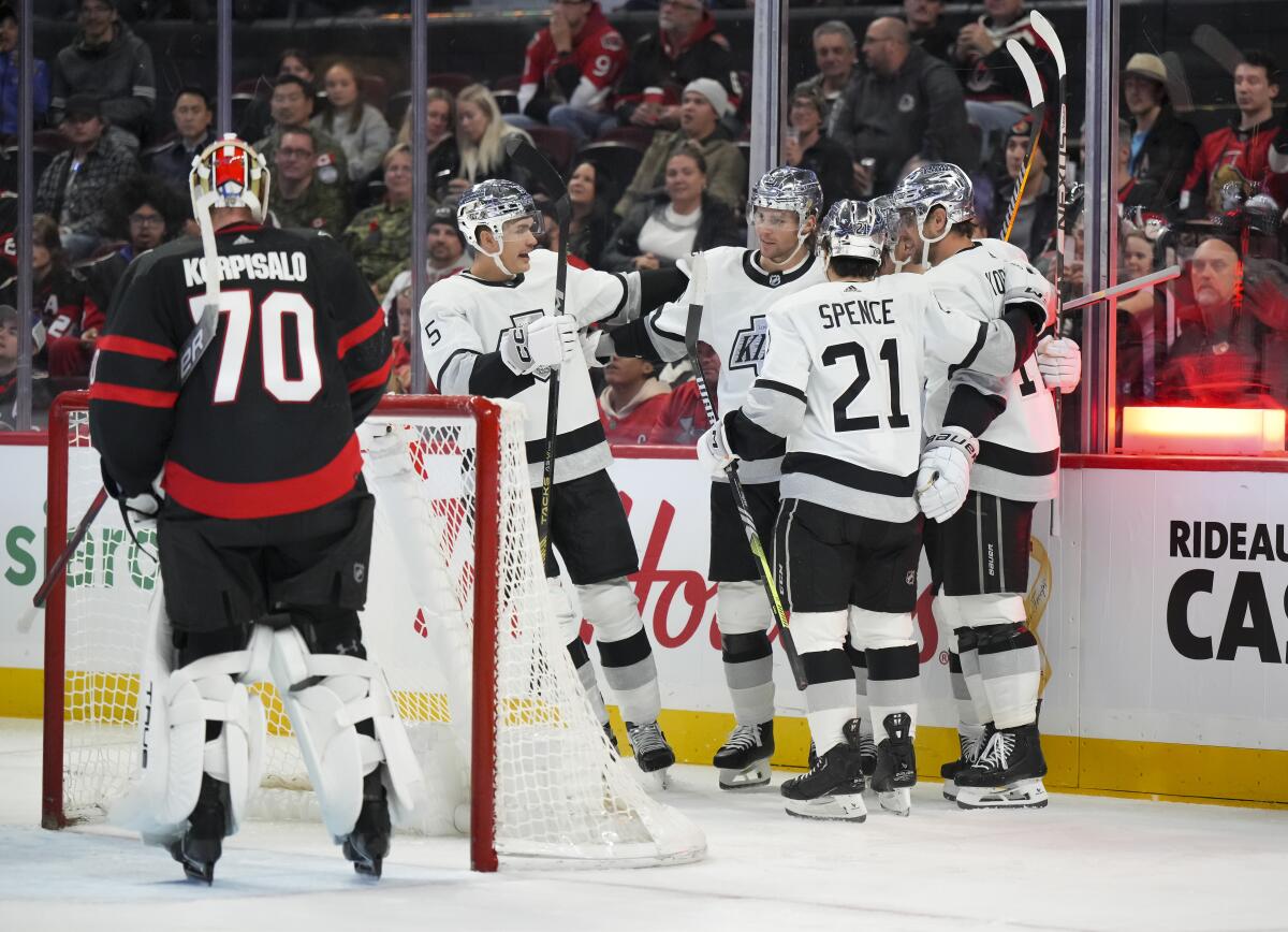 Carl Grundstrom celebrates with teammates after scoring past Ottawa Senators goaltender Joonas Korpisalo.