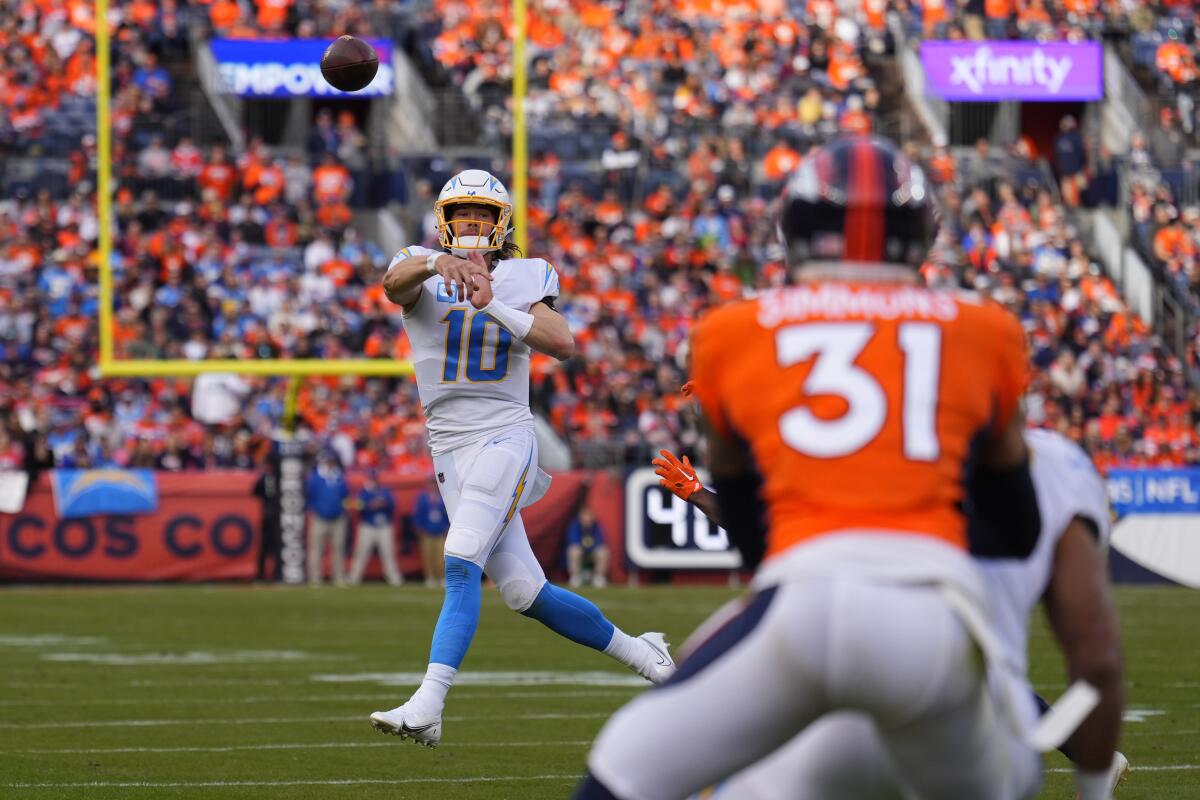 Chargers quarterback Justin Herbert throws against the Denver Broncos in the first half.