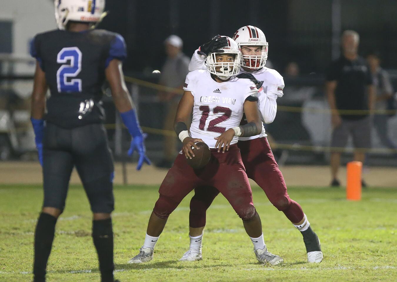 Ocean View High's Kermel Anwell celebrates his 30-yard touchdown catch from quarterback Noah Hickman during a Pac 4 League game at Western on Thursday.