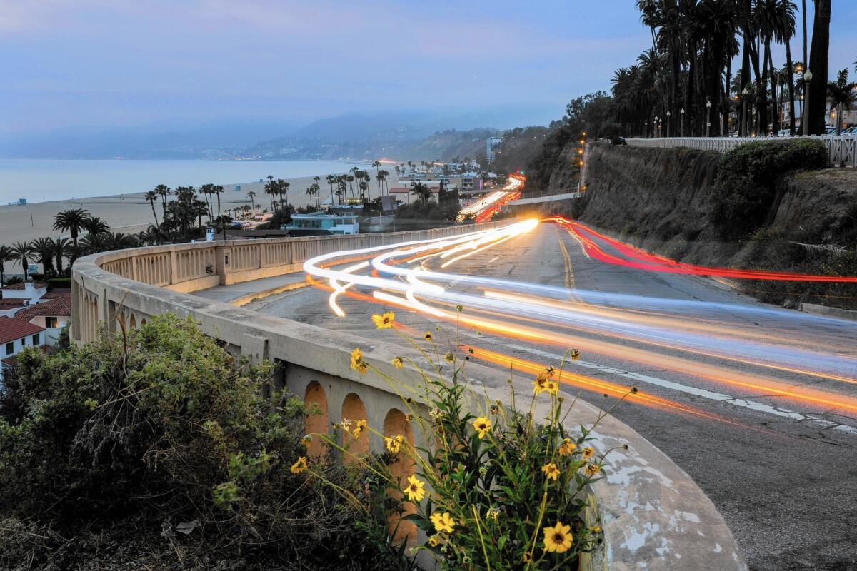 Light trails are captured with a long camera exposure as cars move up and down the California Incline in Santa Monica.