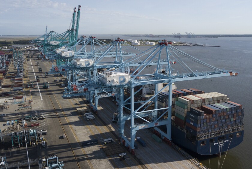 FILE - In this Friday, May 10, 2019 file photo, a container ship is unloaded at the Virginia International Gateway terminal in Norfolk, Va. U.S. factories expanded unexpectedly in January 2020, snapping a five-month losing streak. The Institute for Supply Management, an association of purchasing managers, said Monday , Feb. 3, 20020 that its manufacturing index rose to 50.9 in January, from 47.8 in December. Anything above 50 signals expansion. (AP Photo/Steve Helber, File)