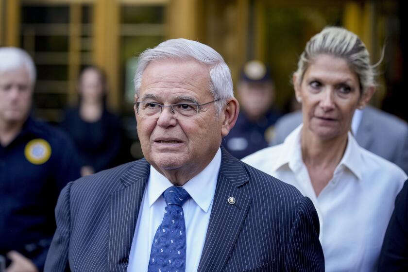 FILE - Sen. Bob Menendez and his wife, Nadine Menendez, leave federal court on Wednesday, Sept. 27, 2023, in New York. Federal prosecutors in New York City have rewritten their indictment against U.S. Sen Bob Menendez of New Jersey and his wife to charge them with conspiring to have him act as an agent of Egypt and Egyptian officials. The superseding indictment was filed in Manhattan federal court on Thursday, Oct. 12. (AP Photo/Seth Wenig, File)
