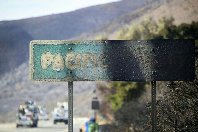 A fire-damaged Pacific Coast sign remains standing along the Pacific Coast Highway amid the blackened and charred hills from the Woolsey Fire in Malibu, California on November 15, 2018. - Much of the area remain under evacuation one week after the Woolsey Fire started. (Photo by Frederic J. BROWN / AFP)FREDERIC J. BROWN/AFP/Getty Images ** OUTS - ELSENT, FPG, CM - OUTS * NM, PH, VA if sourced by CT, LA or MoD **