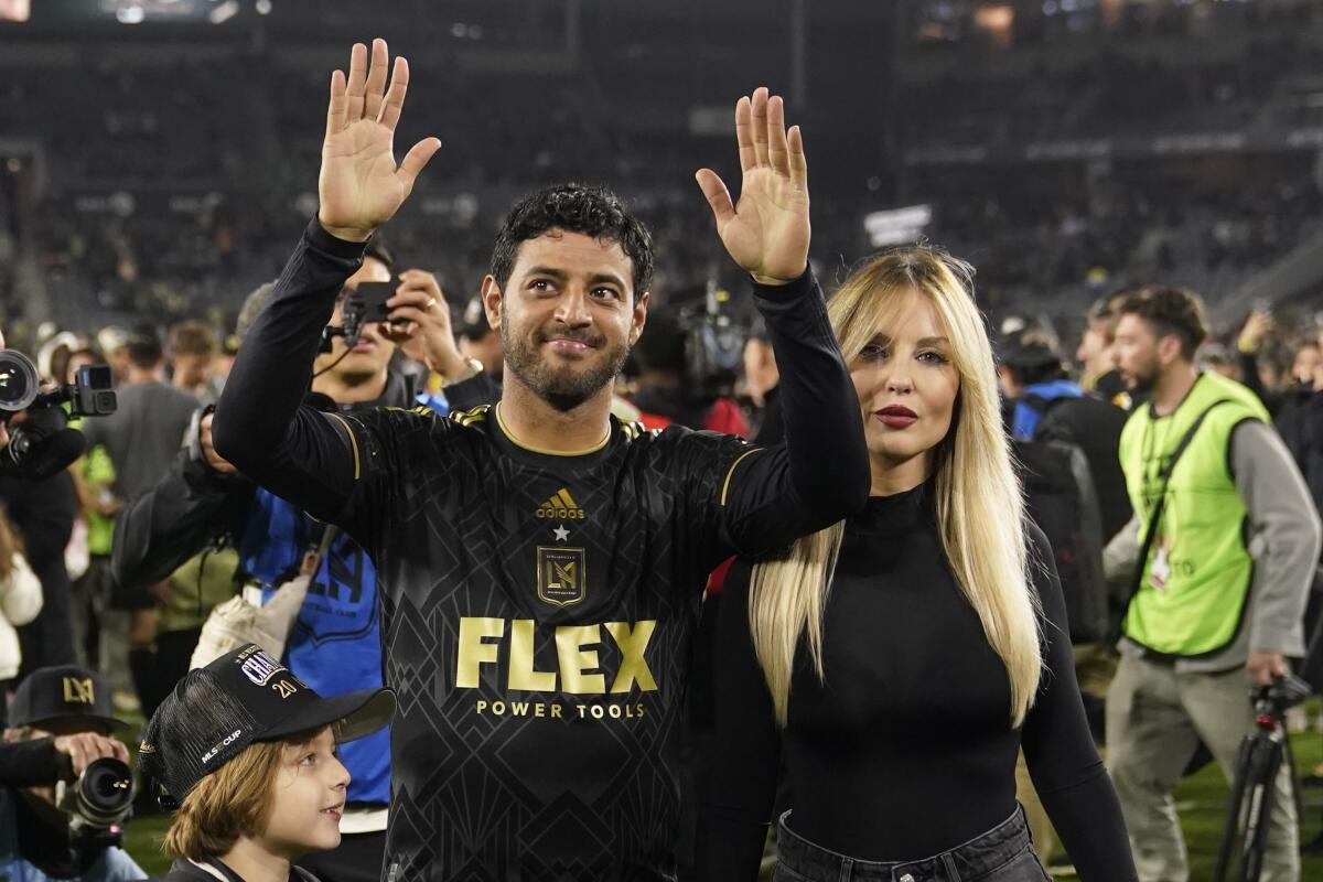 LAFC star Carlos Vela celebrates alongside his wife, Saioa Cañibano, after a playoff win.