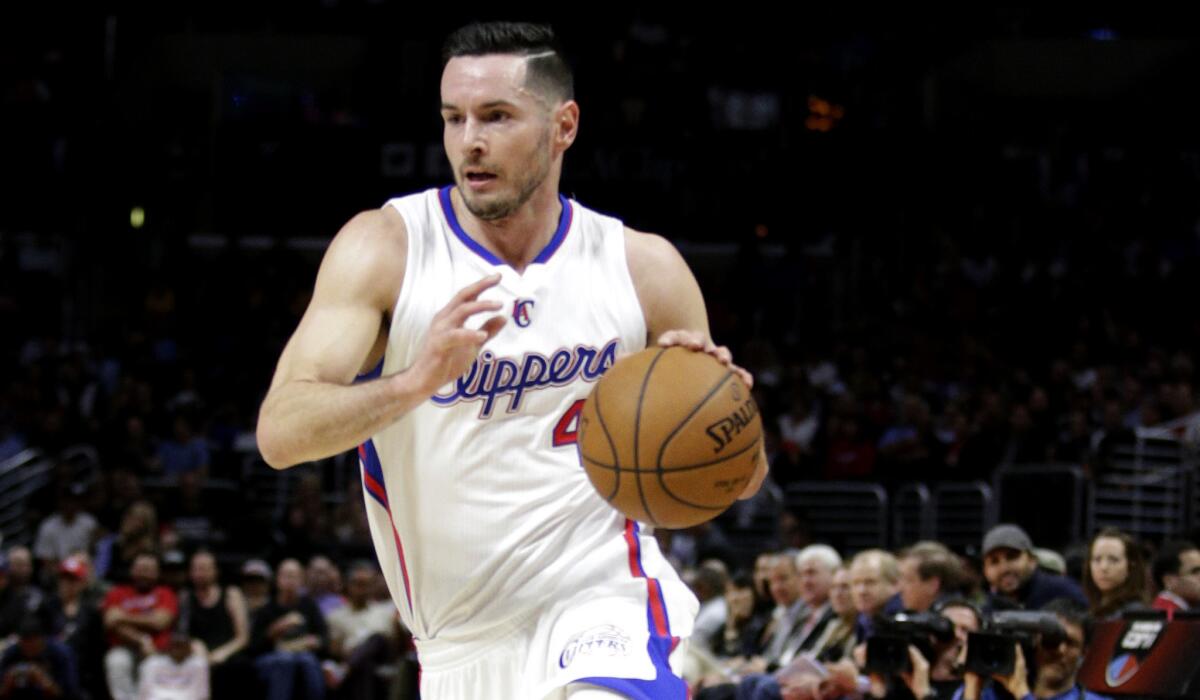 J.J. Redick drives to the basket during a game against the Rockets.