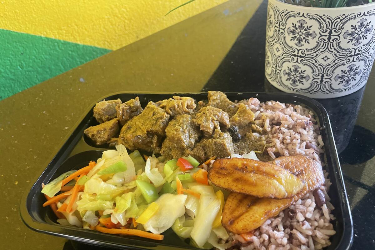 Curry goat plate at Wi Jammin