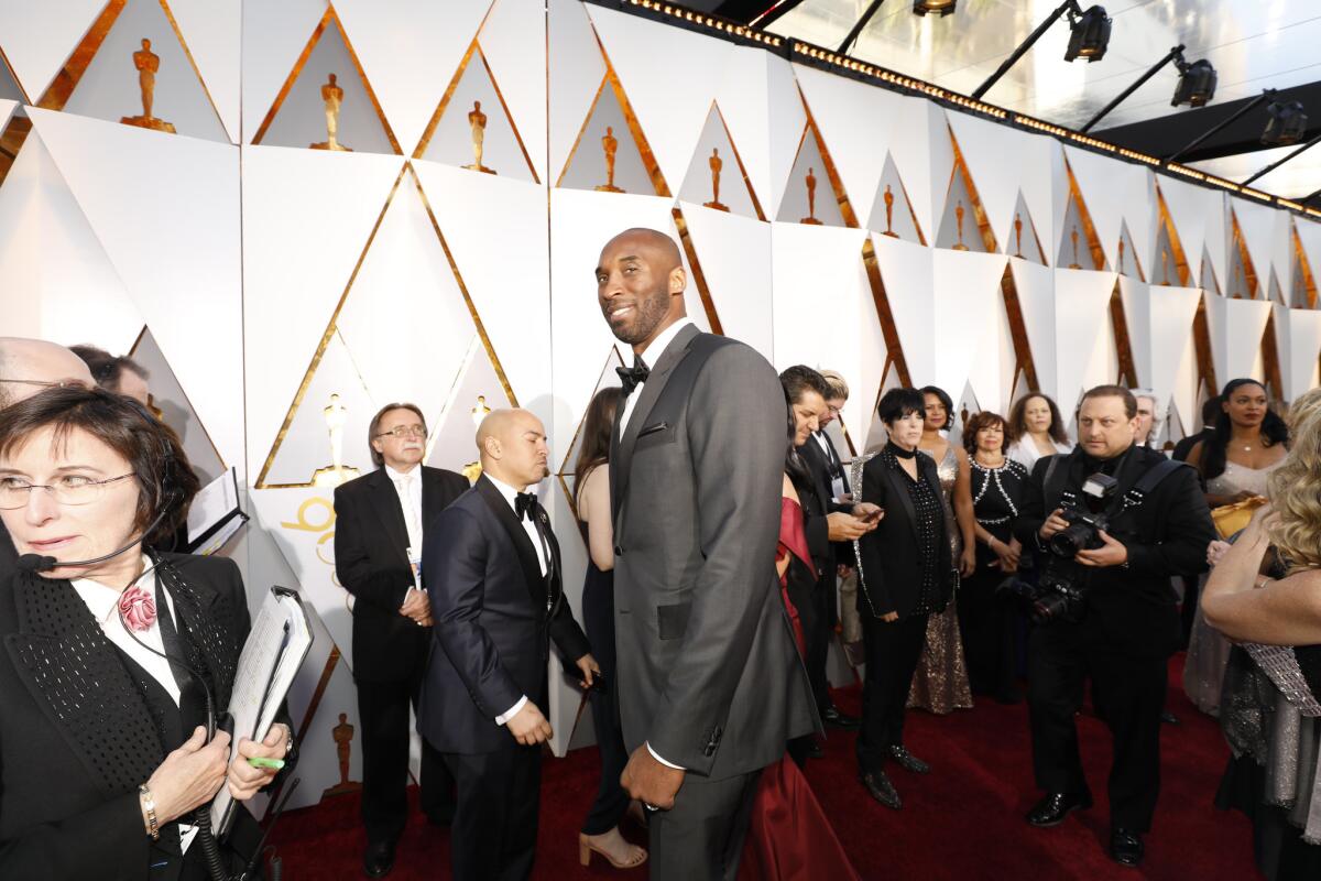 Kobe Bryant walks the red carpet at the Academy Awards ceremony in March.