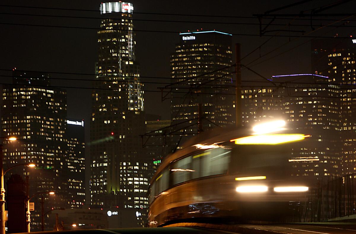 A Gold Line train crosses the 1st Street Bridge in downtown Los Angeles. The Little Tokyo station will be closed until March.