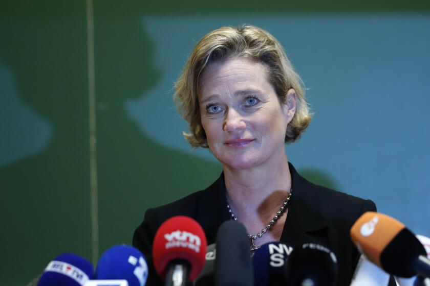 Belgium's artist and sculptor Delphine Boel listens to a question during a press conference in Brussels, Monday, Oct. 5, 2020. Artist and sculptor Delphine Boel is on the cusp of officially becoming a Belgian princess after a Brussels court on Thursday, Oct. 1, 2020 ruled in her favor in a decades-old royal paternity scandal pitting her against former King Albert II. (AP Photo/Francisco Seco)