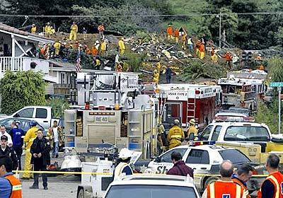 Ventura County emergency personnel search for victims of the La Conchita mudslide.