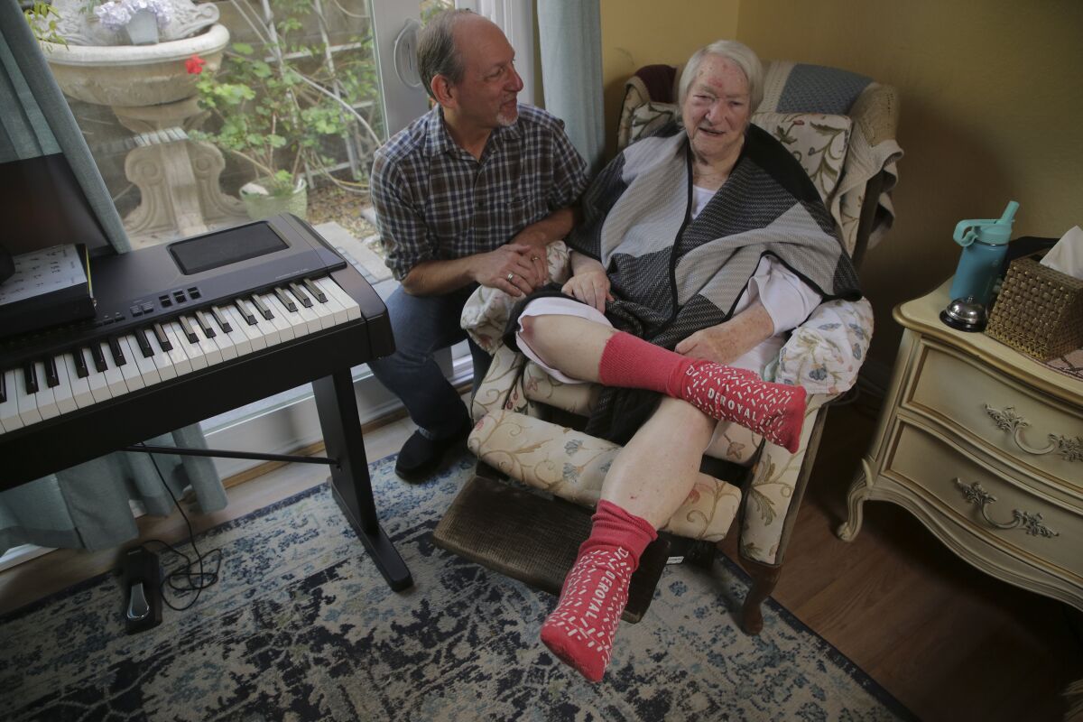 Joshua Lazerson, 62, poses with his friend and former high school teacher, Rose Sleigh, 97, at her home in Carlsbad.