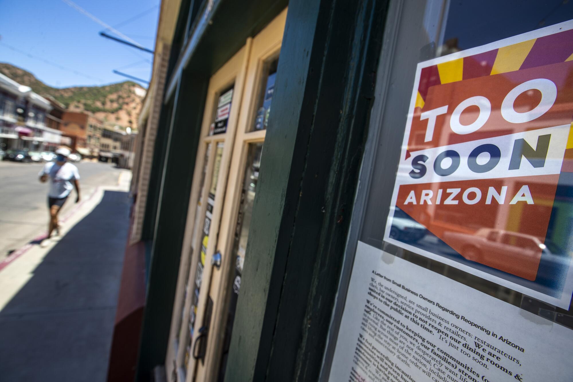 The "Too Soon Arizona" movement is dividing business owners in the tourist town of Bisbee.