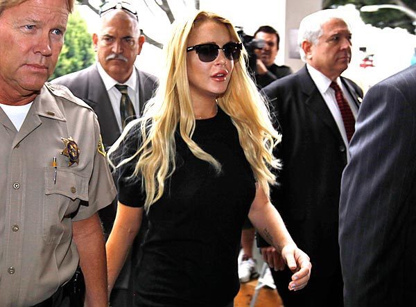 Lindsay Lohan arrives at the Beverly Hills Courthouse in July 2010 for a probation revocation hearing. Her legal woes date back to 2007, when she was arrested twice over a three-month period for allegedly driving under the influence. The star ultimately pleaded no contest and agreed to attend alcohol education classes. See this story See full Lindsay Lohan coverage