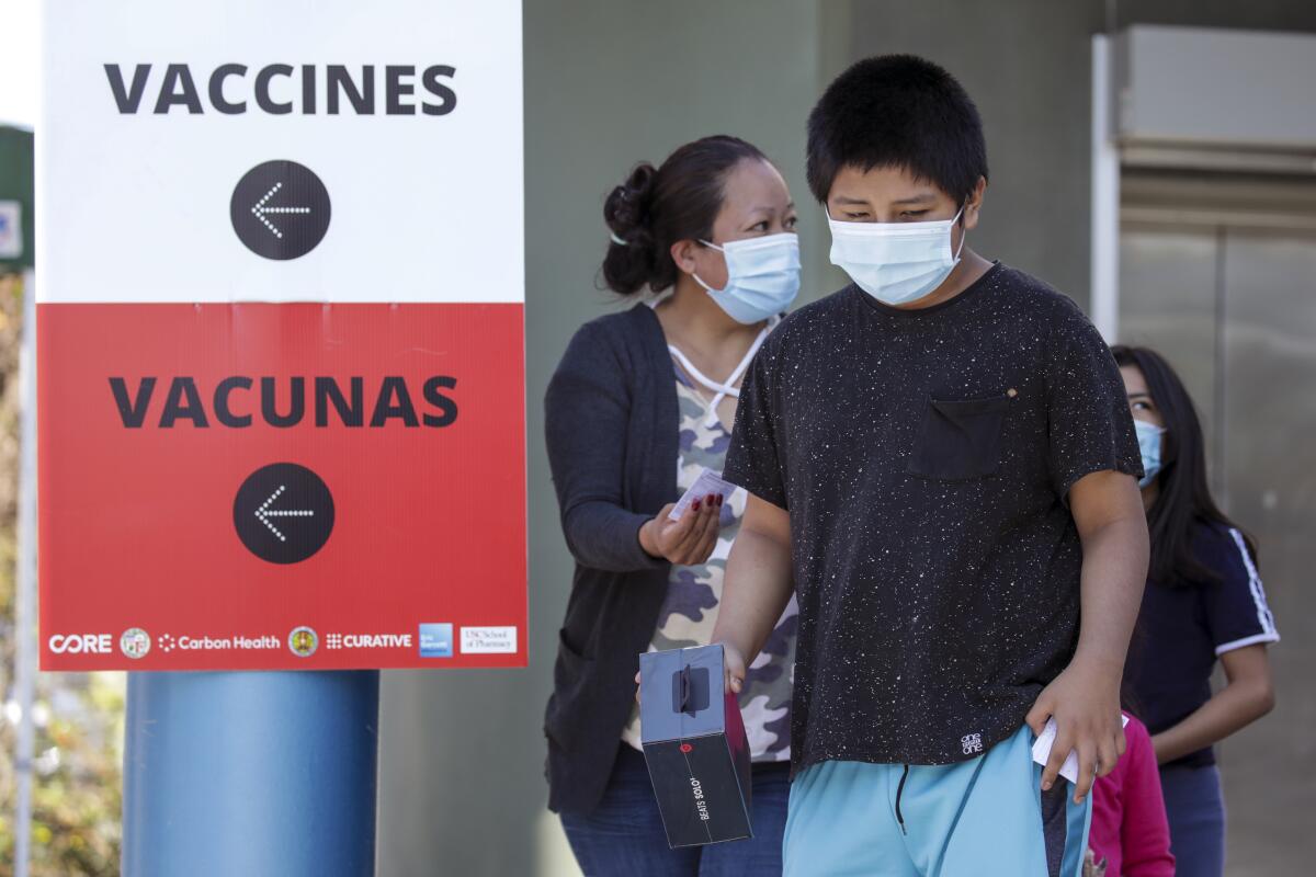 A child leaves a COVID-19 vaccination site.