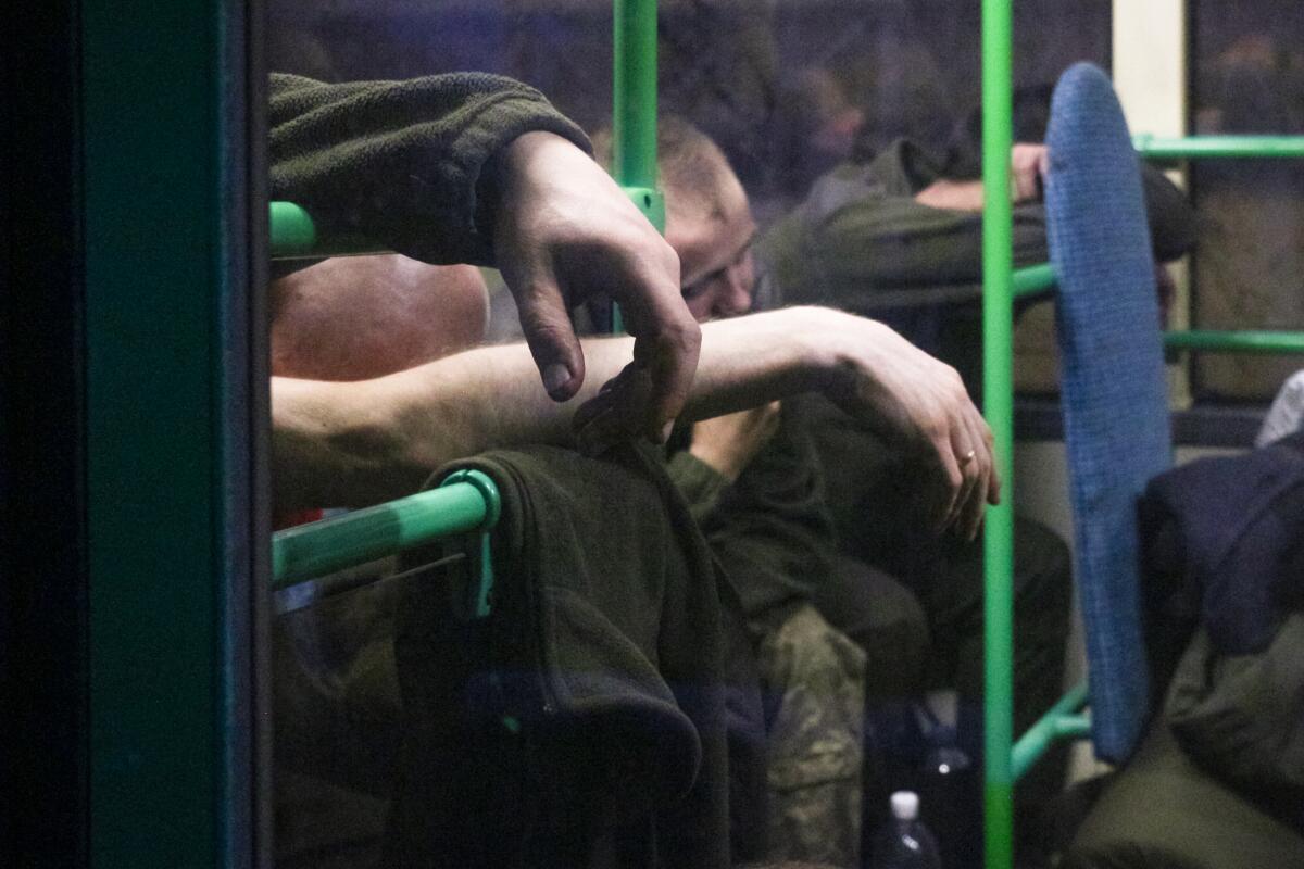 Ukrainian servicemen sitting in a bus