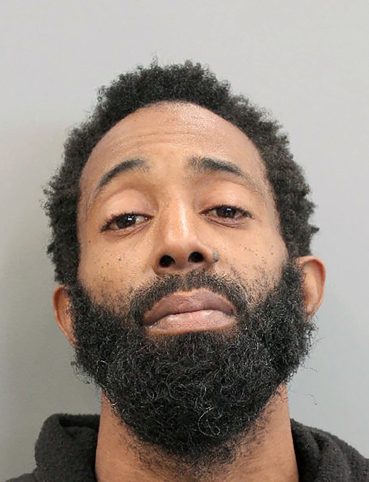 This booking photo provided by the Houston Police Department shows Tony Earls on Tuesday, Feb. 15, 2022. Houston police say Earls, who had been robbed at an ATM on Monday evening, Feb. 14, opened fire in an attempt to stop his attacker but instead shot a 9-year-old girl in a truck driving nearby. The girl later died at a hospital. (Houston Police Department via AP)