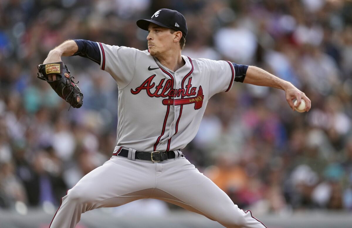 Atlanta Braves starting pitcher Max Fried works against the Colorado Rockies during the first inning of a baseball game Friday, June 3, 2022, in Denver. (AP Photo/David Zalubowski)