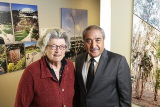 San Diego, CA - March 18: Mary Wolshok (left) and Pradeep Khosla pose for photos at the new UCSD Extension building on Friday, March 18, 2022 in San Diego, CA. (Eduardo Contreras / The San Diego Union-Tribune)
