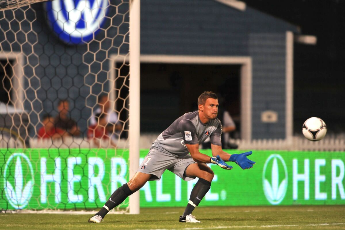 Paris Saint-Germain's Nicolas Douchez makes a save against D.C. United during the Herbalife World Football Challenge in 2012 at Robert F. Kennedy Memorial Stadium in Washington.