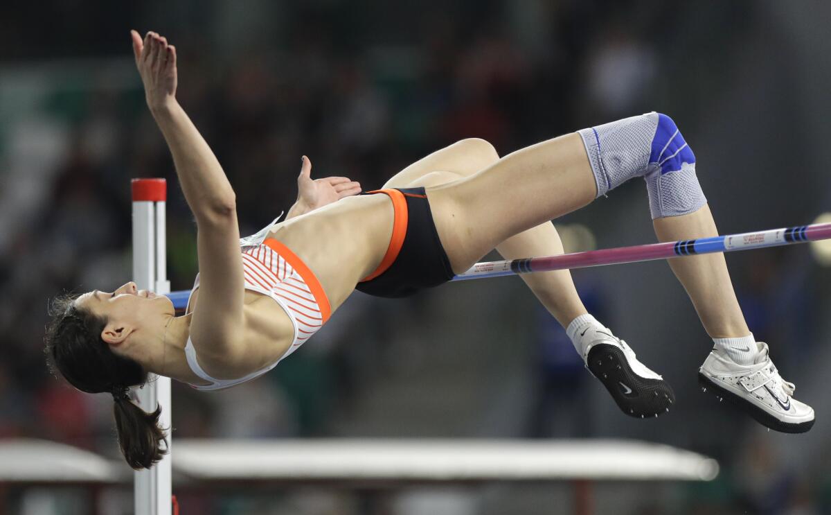 FILE - In this Sept. 10, 2019, file photo, Mariya Lasitskene competes in the women's high jump final during the Match Europe against USA athletics competition on the Dinamo stadium in Minsk, Belarus. Three-time high jump world champion Lasitskene will be a favorite at the upcoming Tokyo Games after Russia named her to its 10-athlete team under rules limiting the size of its squad because of a long-running doping dispute. (AP Photo/Sergei Grits, File)