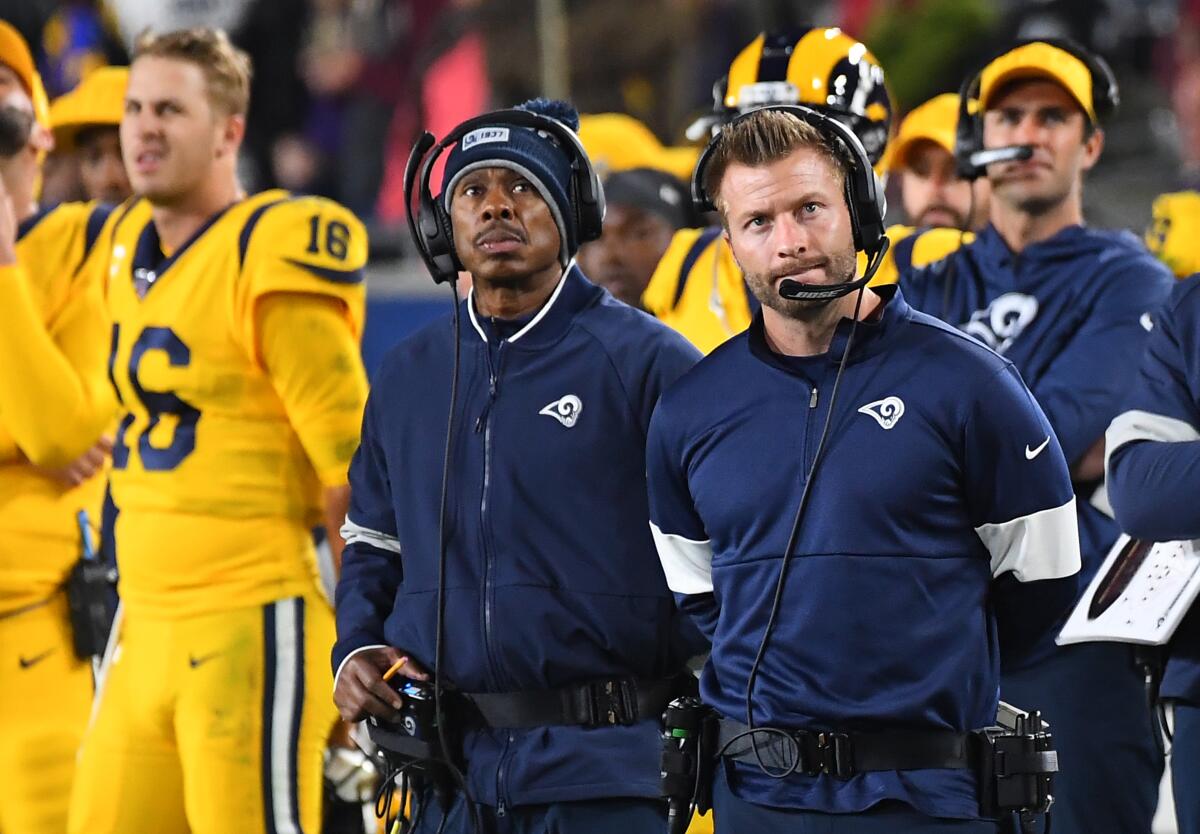 Rams coach Sean McVay watches from the sideline against the Ravens.