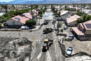 Cathedral City, CA, Wednesday, August 23, 2023 - Scenes of the aftermath of flooding from Tropical Storm Hilary as crews and residents of Horizon Rd. dig out from mud as deep as four feet. (Robert Gauthier/Los Angeles Times)
