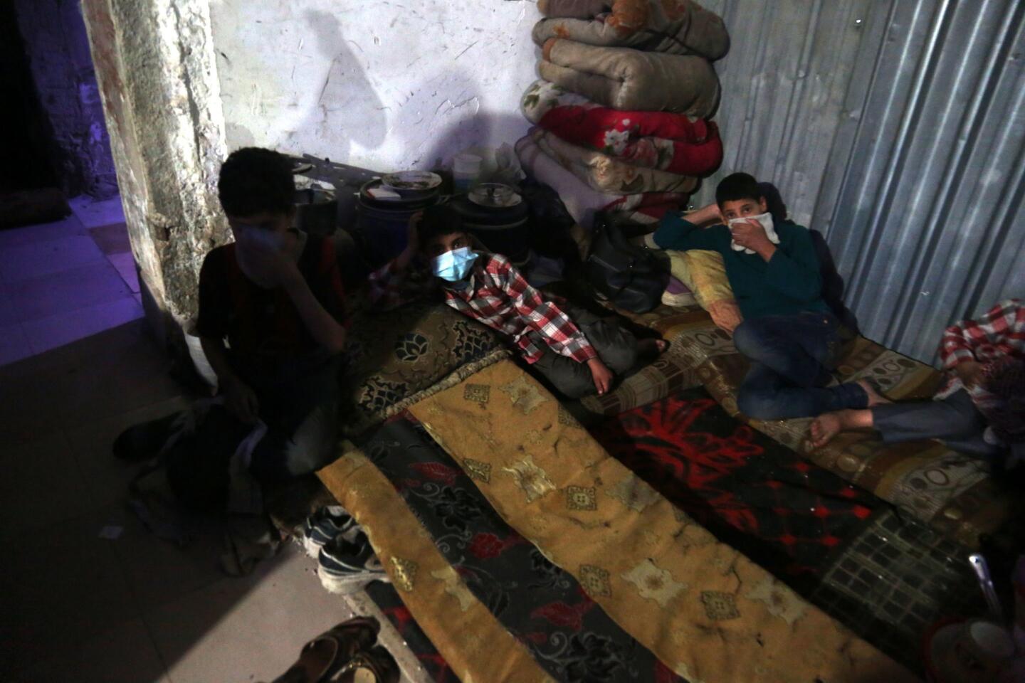 Injured victims of an alleged chemical attack rest in rebels-held Douma, Syria, on April 8, 2018. According to media and local reports, at least 70 people died after a helicopter dropped a barrel bomb allegedly containing Sarin gas, a nerve toxin that kills within minutes of direct inhalation unless treated quickly with an antidote.