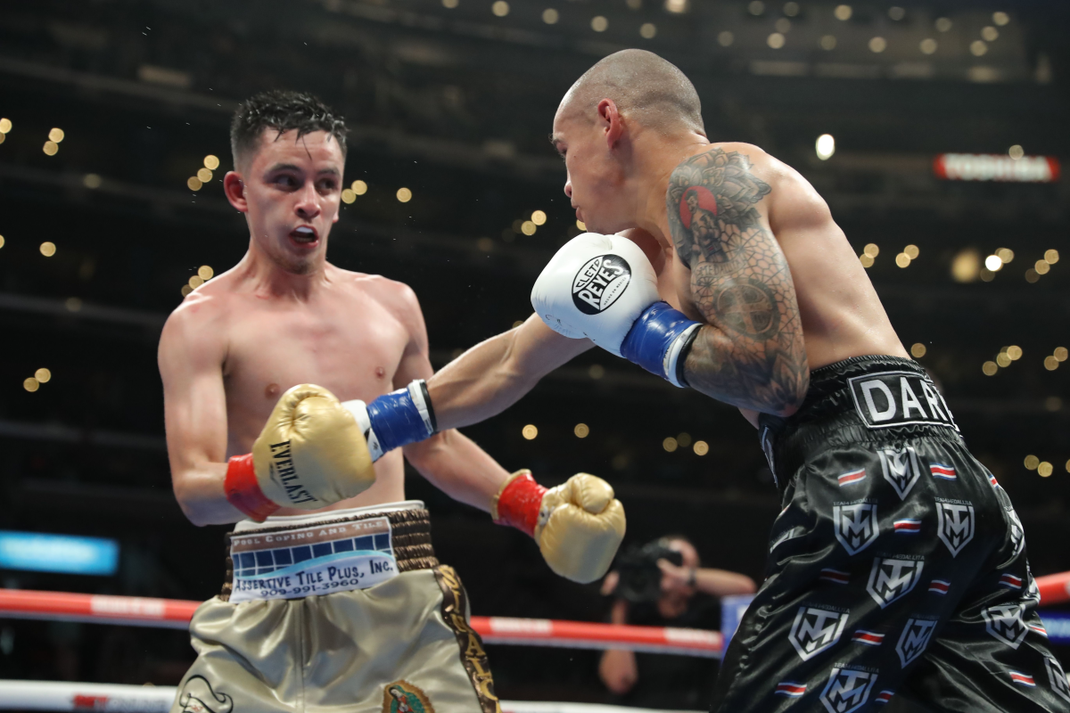 David Jimenez, right, throws a punch at Ricardo Sandoval during their fight on Saturday.