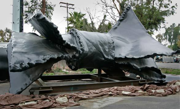 The 65-foot metal and fiberglass bow tie languishes in Irvine. When technical problems delayed the project, a two-year extension was granted, but the second deadline was missed as well.