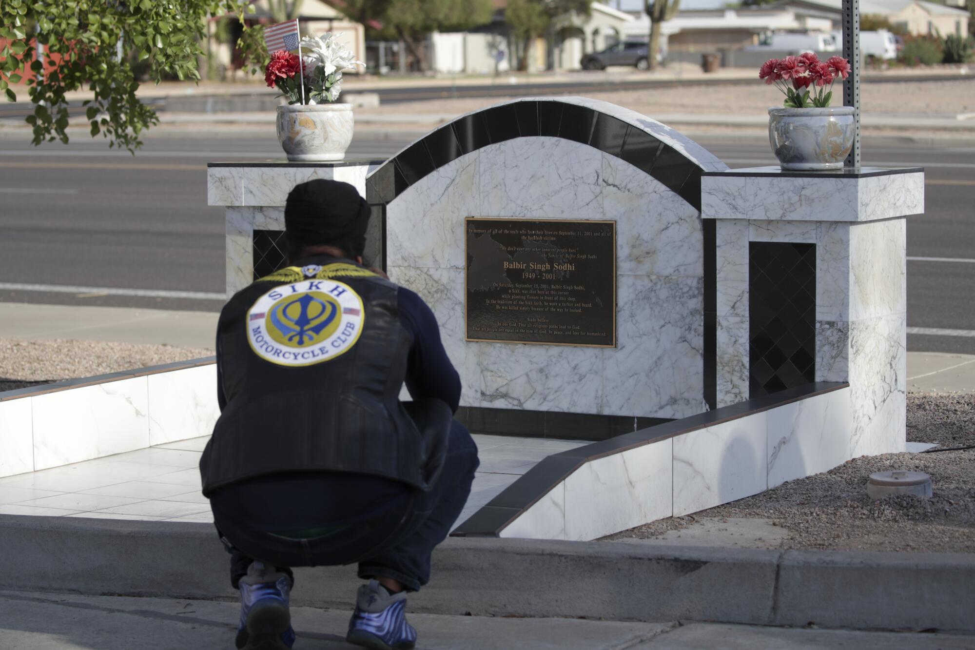 Ajay Singh Bainiwal stops to pay respect at a memorial for Balbir Singh Sodhi