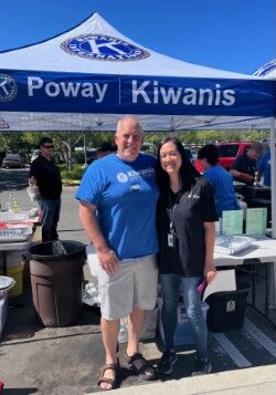 John Couvrette, president of the Poway Kiwanis, poses with Kathy Jung, Poway head librarian.