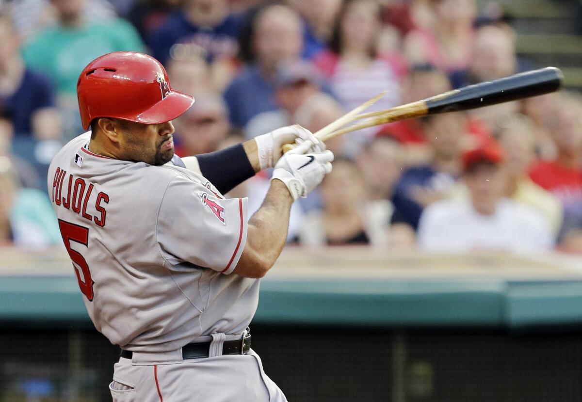 Albert Pujols breaks his bat while grounding out with the bases loaded in the fourth inning of the Angels' 4-3 loss to the Cleveland Indians.