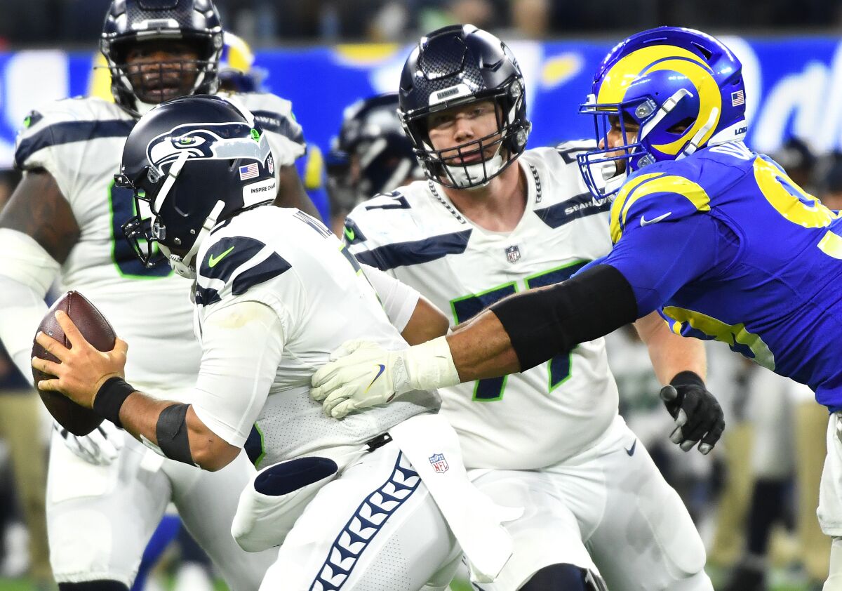 The Rams' Aaron Donald sacks Seahawks quarterback Russell Wilson in the fourth quarter.