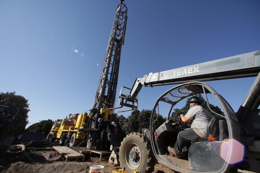 Terra Bella, CA - October 13: Matt Davis's company drills a 1300 feet deep well Setton Farms on Wednesday, Oct. 13, 2021 in Terra Bella, CA. (Irfan Khan / Los Angeles Times)