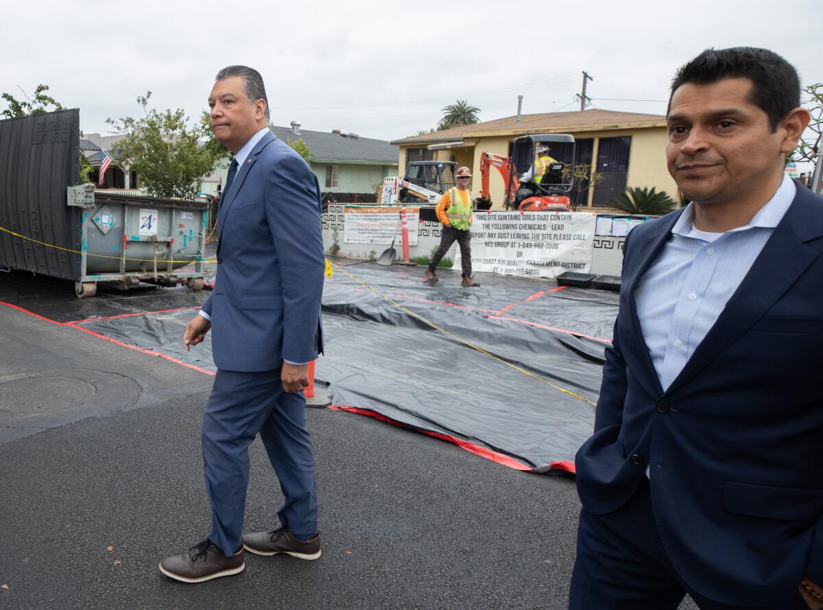 U.S. Senator Alex Padilla and Assemblymember Miguel Santiago visit a house in the Boyle Heights neighborhood of Los Angeles.