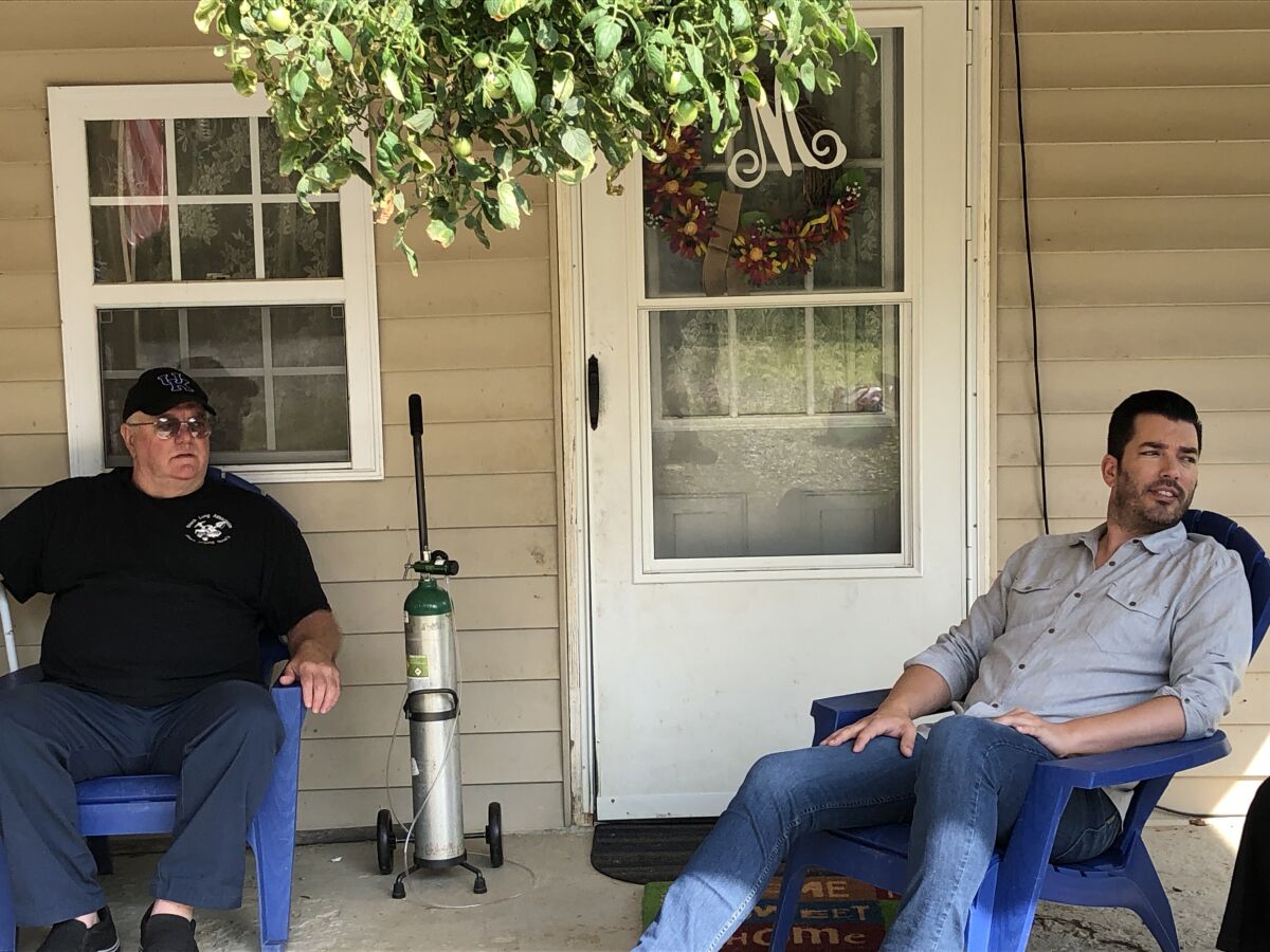 Jonathan Scott sits with William Hoss McCool on McCool's porch