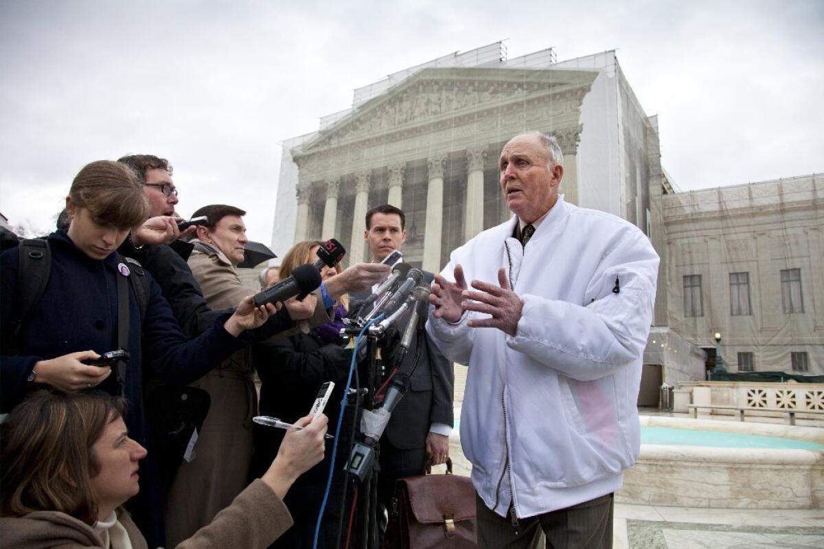 Hugh Bowman, a 75-year-old Indiana soybean farmer, speaks with reporters outside the Supreme Court after justices heard oral arguments between Bowman and high-tech agriculture company Monsanto Co., which produces genetically engineered and patented seeds.