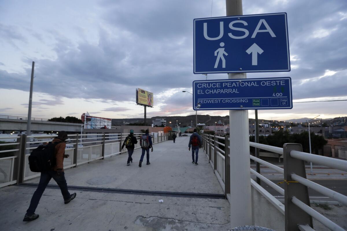Haitians make their way toward the border crossing in Tijuana in 2016.