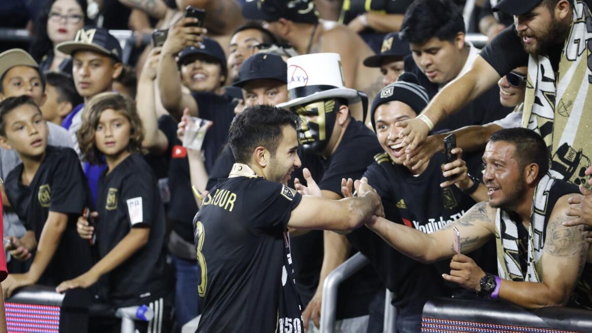 LAFC's Steven Beitashour greets fans after a 2-2 tie with the Galaxy on July 26 at Banc of California Stadium.