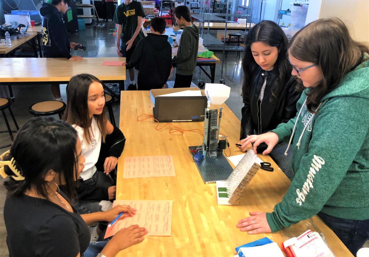 Costa Mesa Middle School students collaborate with high schoolers enrolled in an Engineering Design pathway.