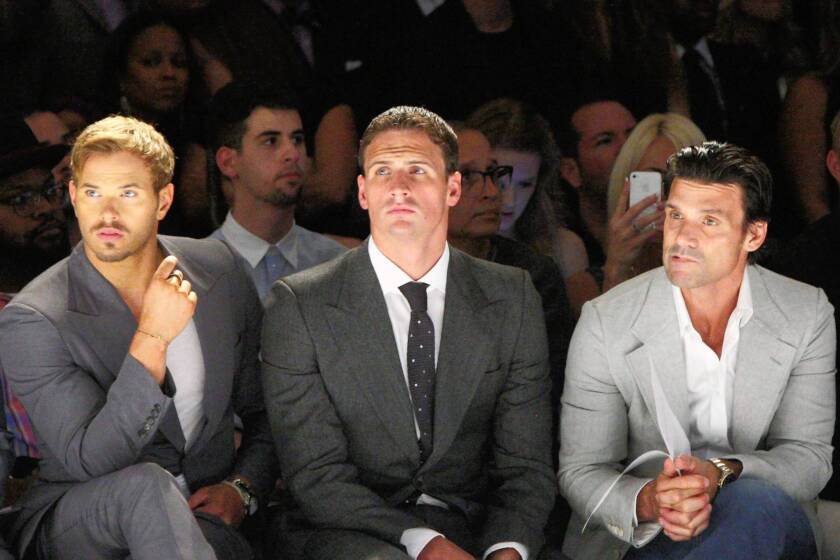 Brad Richards, left, Kellan Lutz and Ryan Lochte are seated front row at Joseph Abboud.