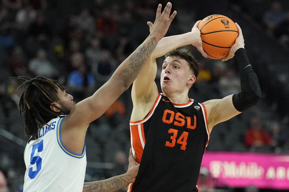 Oregon State forward Tyler Bilodeau looks to shoot over UCLA guard Brandon Williams during a Pac-12 tournament game in March.