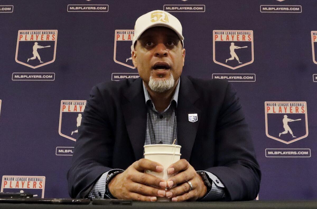 In this Feb. 19, 2017, photo, Tony Clark, MLBPA executive director, answers questions at a news conference in Phoenix.