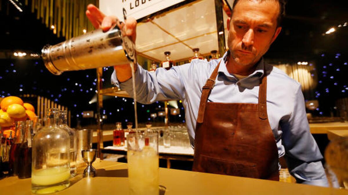 Andy Seymour, a mixologist with the Hilhaven Lodge and Diageo Brands, mixes the Fireside, the signature Emmy cocktail.