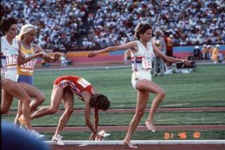 Mary Decker gets tangled up with Zola Budd and falls in the women's 3,000 meters.