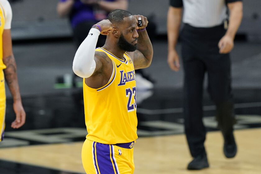 Los Angeles Lakers forward LeBron James (23) reacts after he was fouled during the first half.