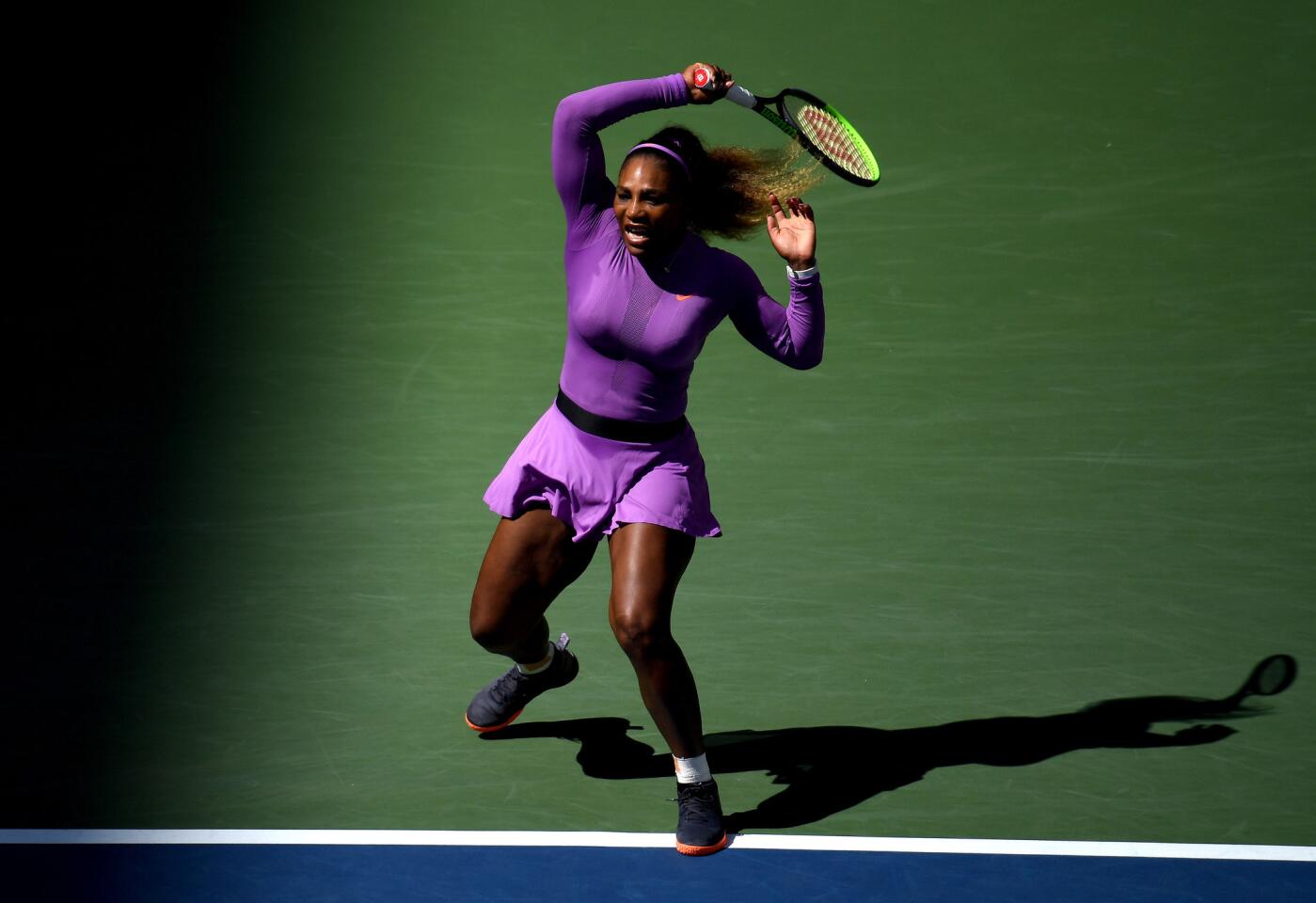 Serena Williams returns a shot during her Women's Singles third round match against Karolina Muchova in the 2019 U.S. Open in Arthur Ashe Stadium inside the Billie Jean King National Tennis Center on Aug. 30, 2019, in Queens.