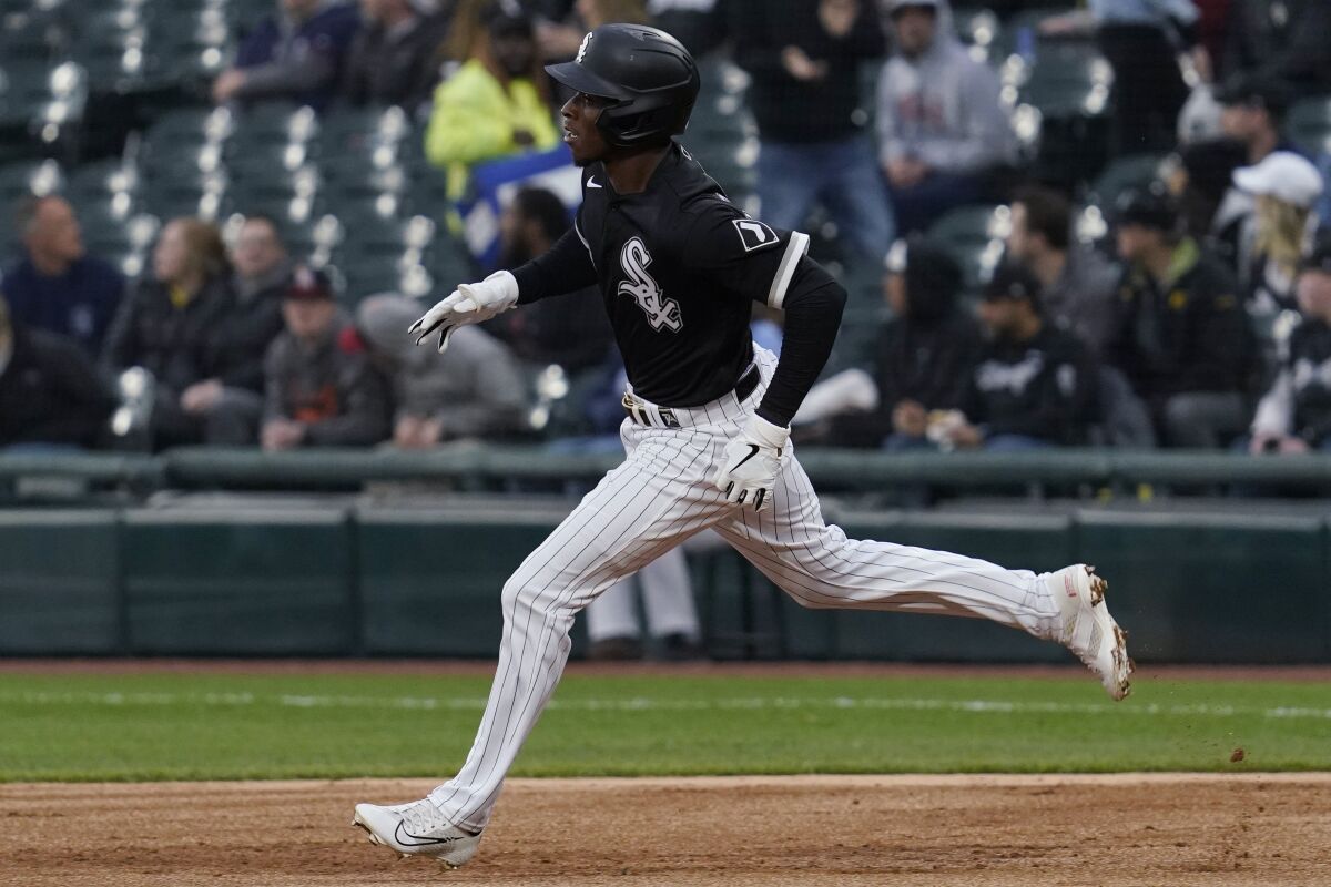Chicago White Sox's Tim Anderson runs to second base after hitting a double against the Los Angeles Angels during the first inning of a baseball game in Chicago, Friday, April 29, 2022. (AP Photo/Nam Y. Huh)