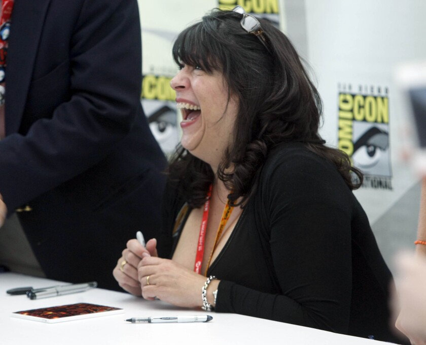 Author E.L. James signing books at San Diego's Comic-Con in 2012.