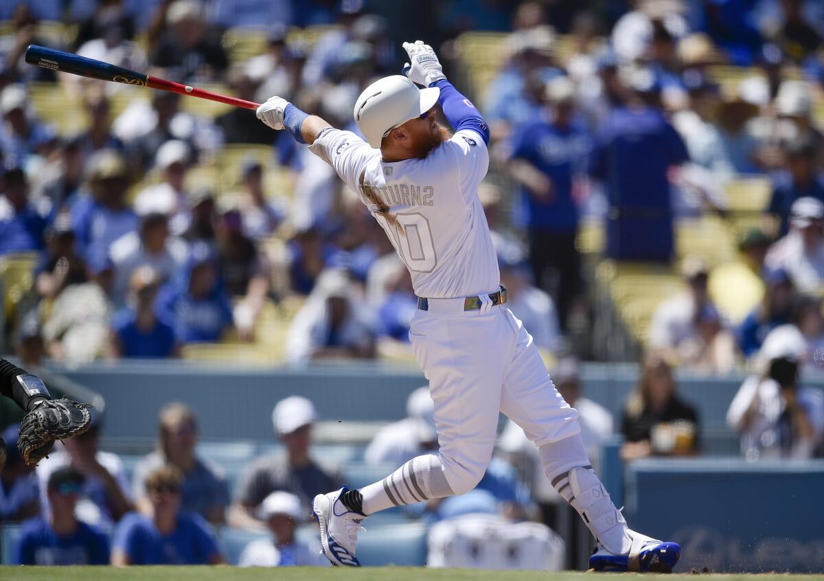 Justin Turner follows through on a two-run home run during the third inning of the Dodgers' 2-1 win over the New York Yankees on Saturday.